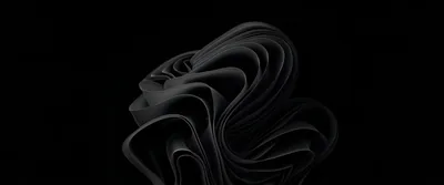 The Windows 11 bloom shape rendered as layered dark ribbons curling in on themselves, set slightly left of centre with the rest of the ultrawide frame in black.