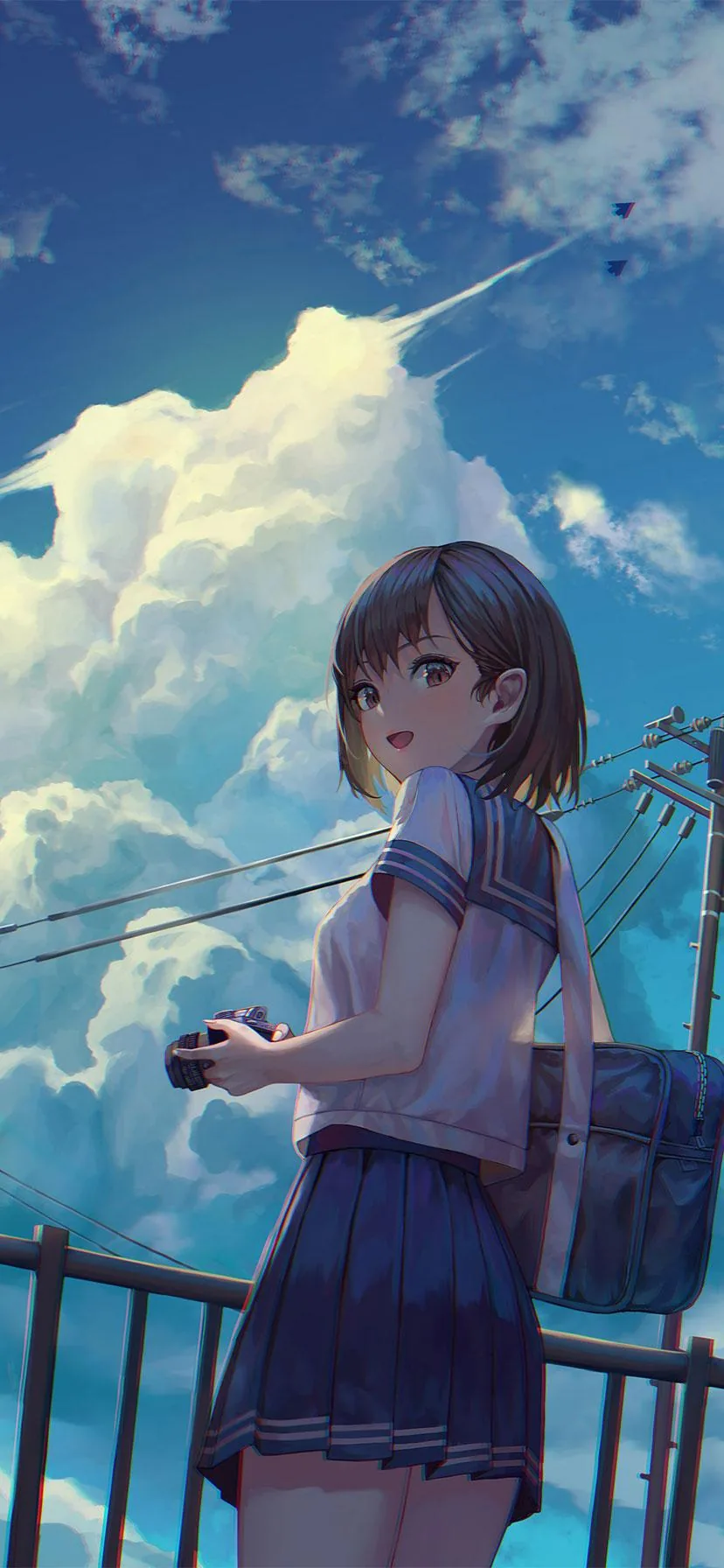 A short-haired schoolgirl glances back with a camera in hand, towering summer clouds and power lines rising behind the railing where she stands.