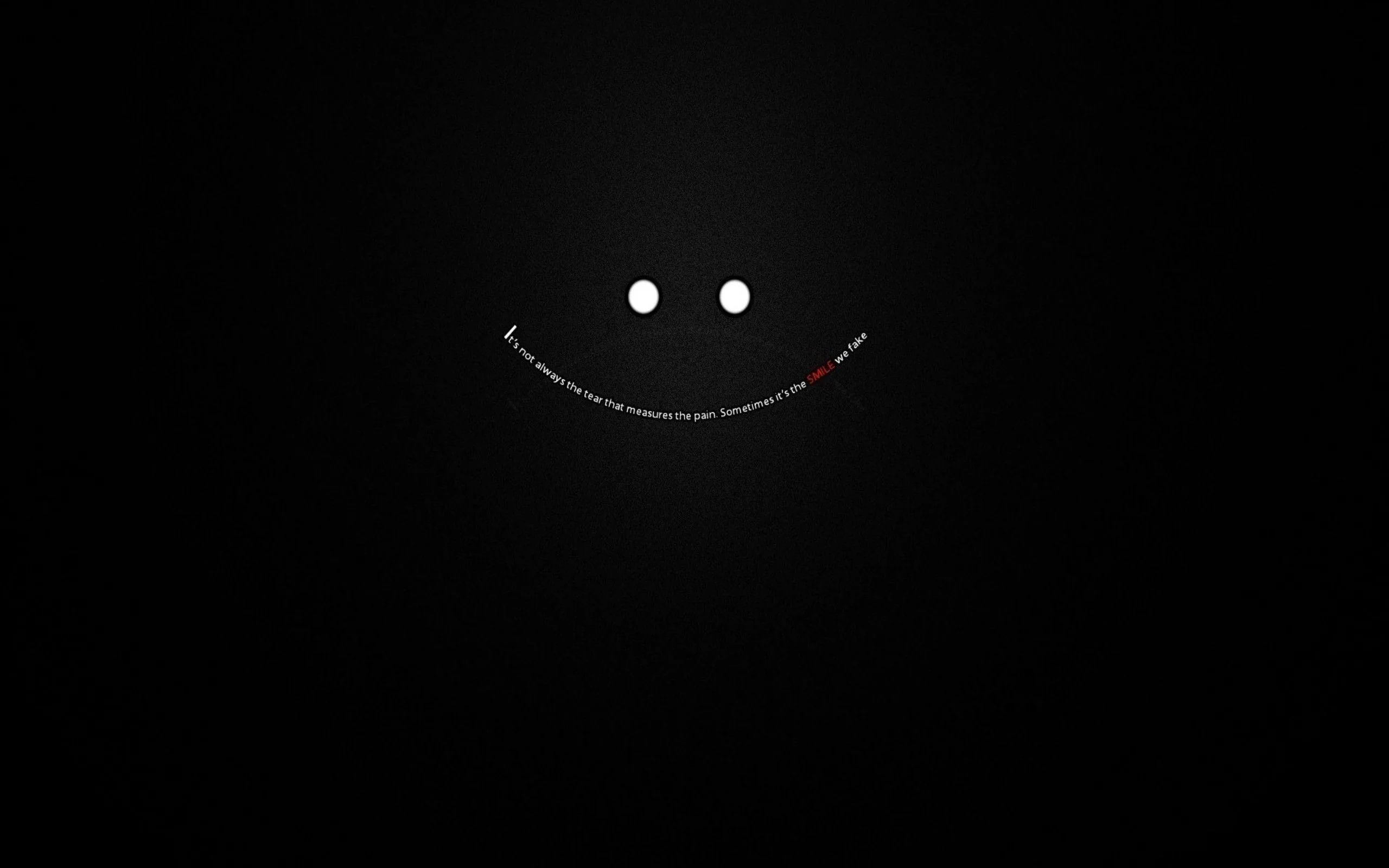 Two small white dots and a curved line of tiny type form a smile, floating on a soft black gradient.