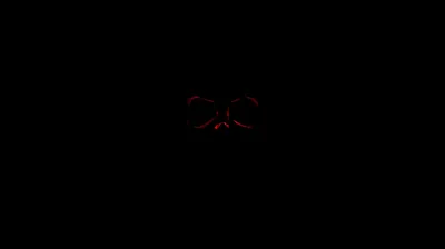 Almost the whole frame is true black, with only a faint red shape surfacing near the centre — close to #000000 for AMOLED.