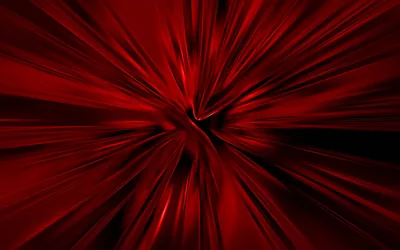 Streaks of red pull outward from a point just left of centre in a motion blur, darkest at the corners of the frame.