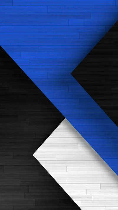 Flat wood-grain panels in cobalt, black and white meet in sharp chevrons, the blue arrow pointing down through the centre of the frame.