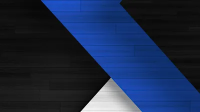 A wide blue band runs diagonally across horizontal dark wood planks, meeting a small white triangle near the bottom of the frame.