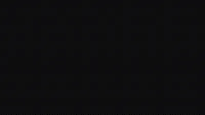 Almost the whole widescreen frame reads as solid black, slightly lighter vertical strips surfacing only on a bright display.