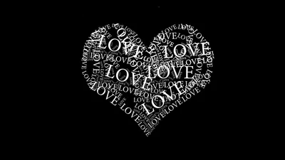The word love repeats in white type at every angle until the letters build a filled heart on pure black.