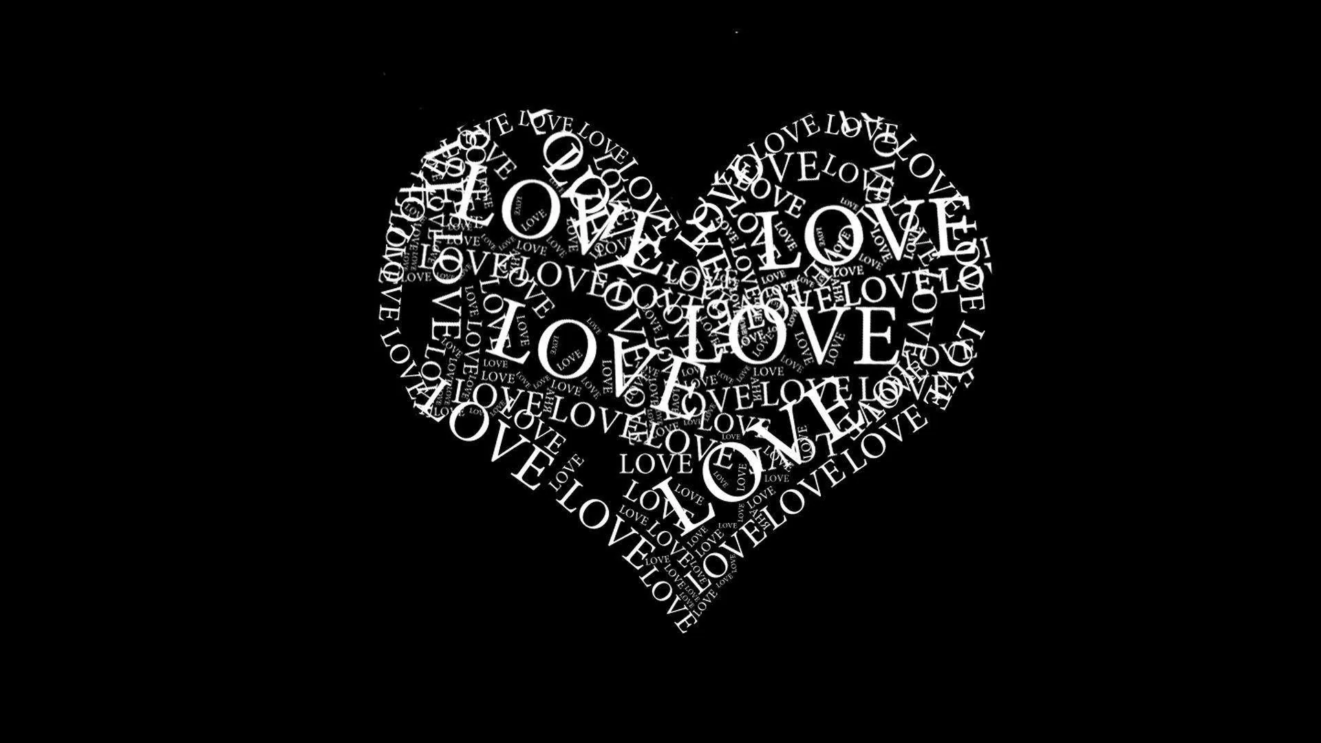 The word love repeats in white type at every angle until the letters build a filled heart on pure black.