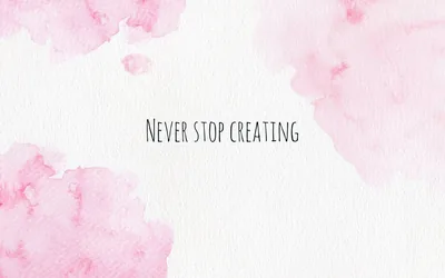Blots of rose-pink watercolour bleed in from the corners of textured cream paper, the phrase never stop creating hand-lettered across the centre.