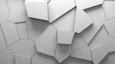 A wall of white polygon blocks extruded at different depths, soft shadows along each seam giving the flat grey surface its 3D relief.