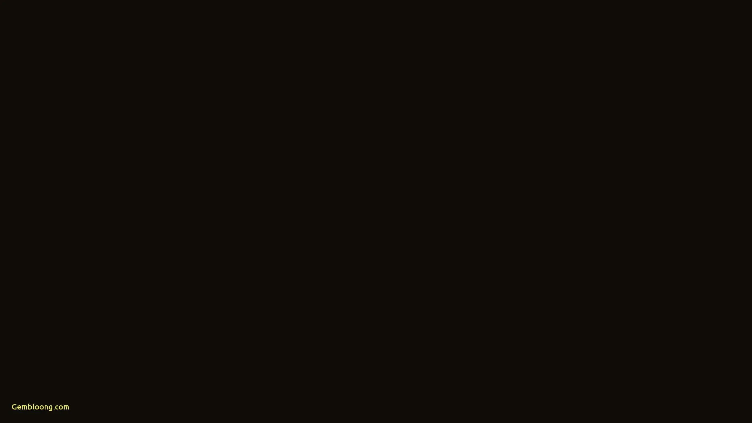 A completely flat black field with the faintest warm cast to it, broken only by a small line of grey text in the bottom left corner.