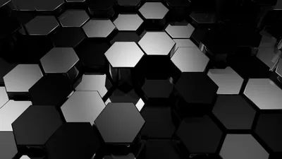 Hexagonal panels sit at slightly different heights, catching a cold light along their bevels while the gaps between fall to near black.