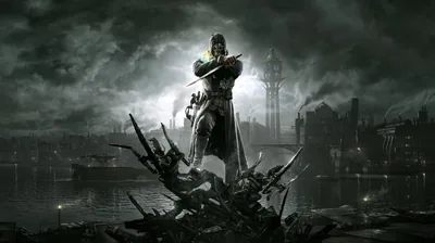 A masked figure in a long coat stands on a heap of broken timber, a lit tower and smoking rooftops behind under heavy cloud.