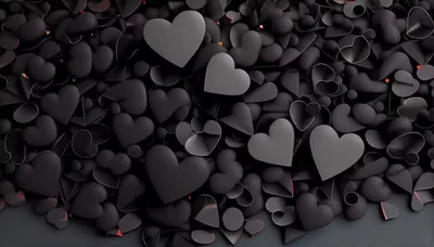 Hundreds of rounded black hearts heap up in a 3D render, faint red rims and a low light source separating the front layer.