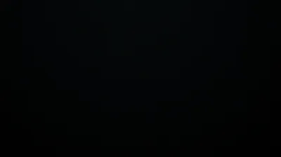 Black from edge to edge apart from a barely-there lift of tone across the upper middle, close enough to true #000000 for an AMOLED panel.