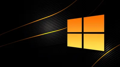 The four-pane mark glows amber on the right side while thin orange and yellow curves sweep past it through the black.