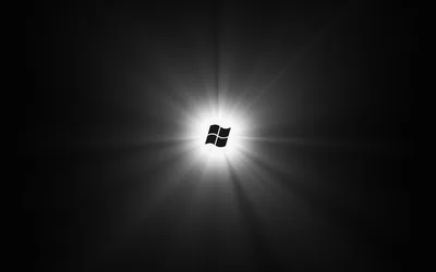 The window mark sits at the centre of a black field with sharp rays of white light radiating out from it.