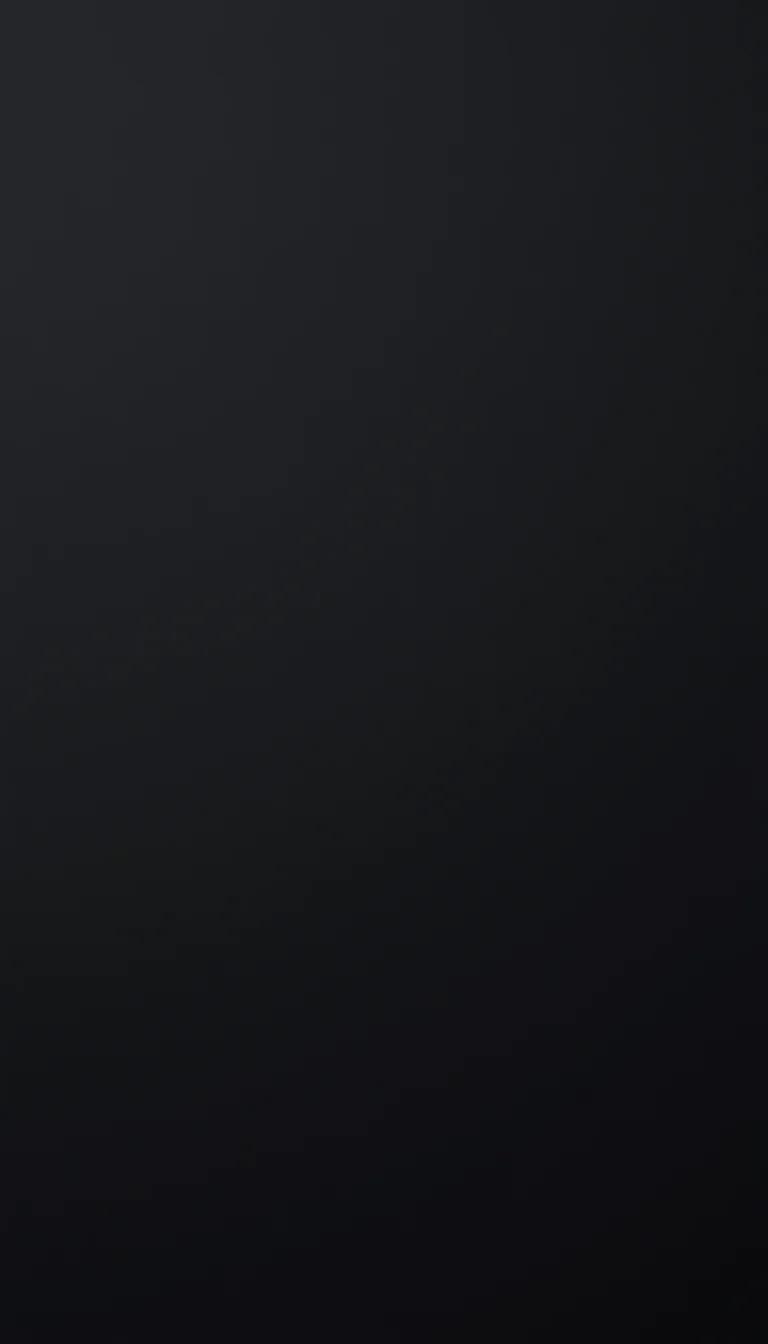 A flat charcoal field shading a shade lighter toward the top left, with nothing in the texture to compete with home screen icons.