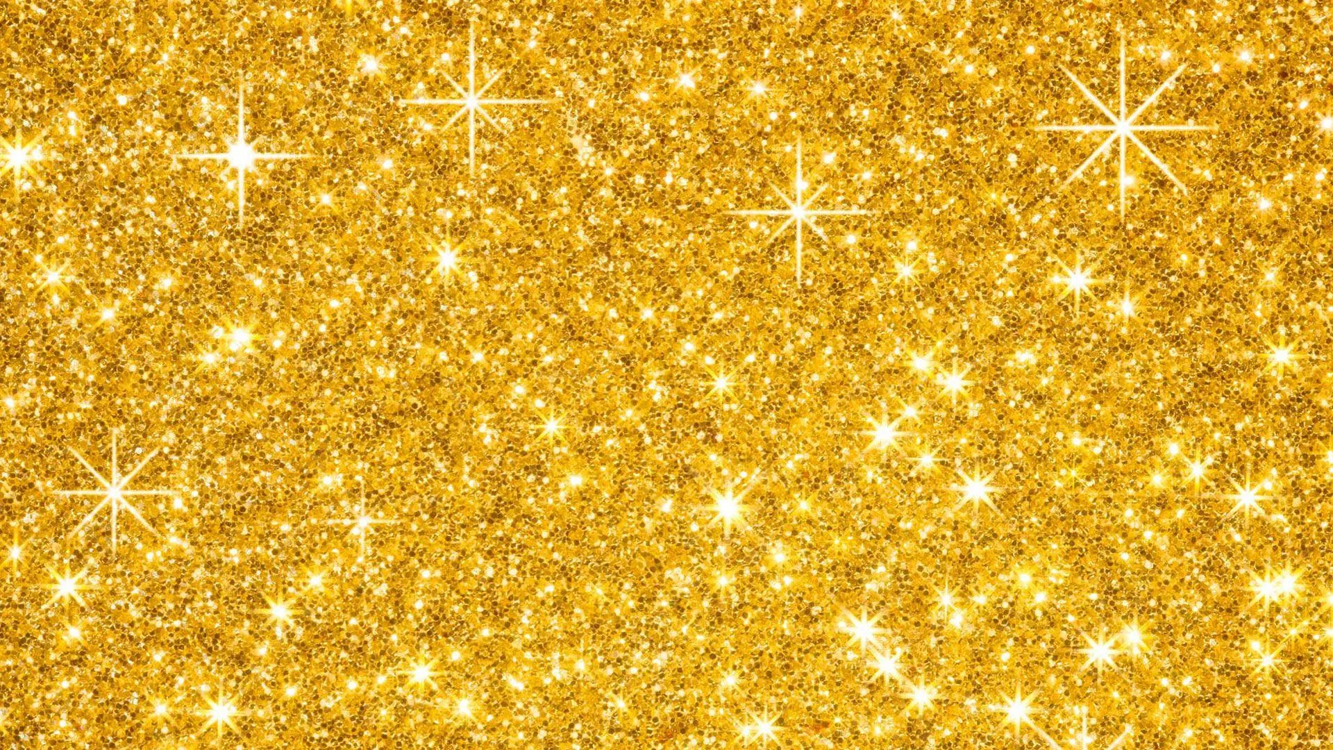 A dense field of gold glitter with four-point starbursts flaring across it, the sparkle spread evenly from edge to edge.