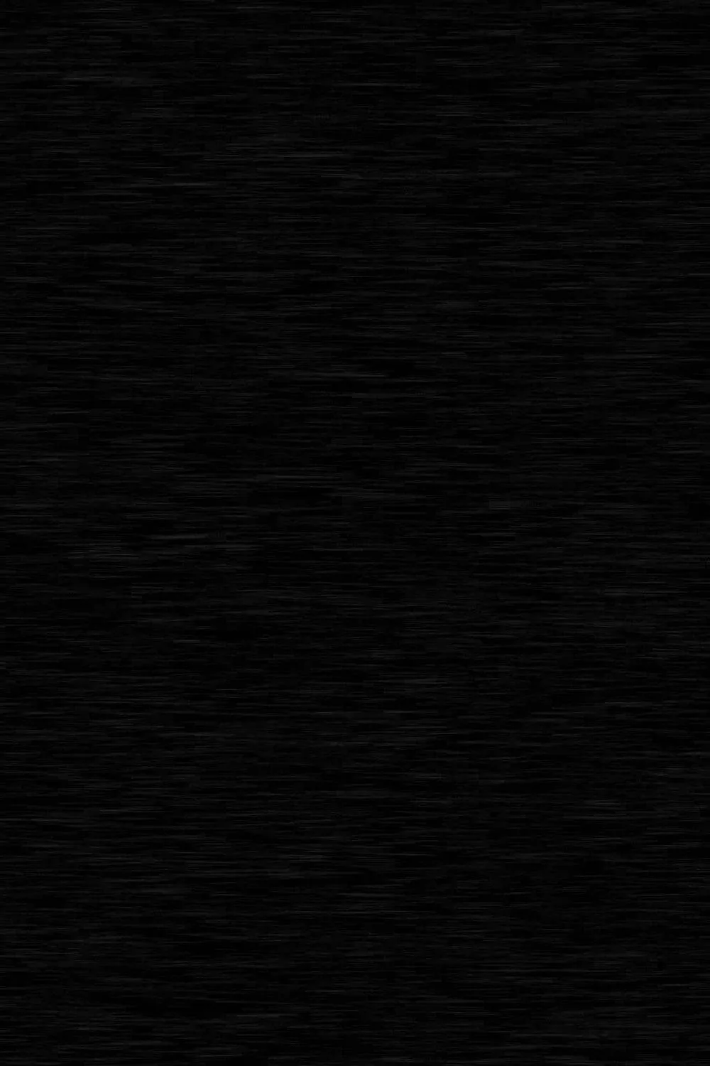 Fine horizontal fibres run edge to edge in near-black, close enough to read as brushed cloth without lifting the tone off true dark.