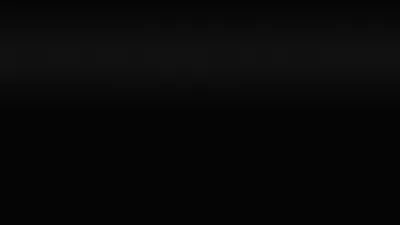 A narrow band of grey light sits along the top edge and drops away fast, leaving the lower two thirds of the frame at true black.