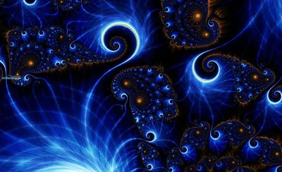 Electric-blue fractal currents coil into spirals studded with beads of orange, filling the frame edge to edge with swirling detail.