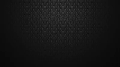A small diamond motif tiles the upper half of the frame and dissolves into a soft black gradient below.