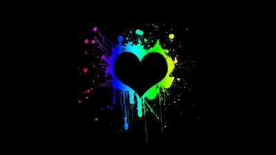 A solid black heart sits inside a burst of magenta, cyan and lime paint that drips downward, the rest of the frame left in flat black.