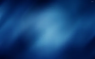 Soft diagonal streaks drift across a navy field like smoke behind glass, the corners darkening into a natural vignette.