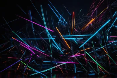 Dozens of thin light rods in blue, orange and pink lie crossed at random angles, their glow catching the dark floor beneath them.