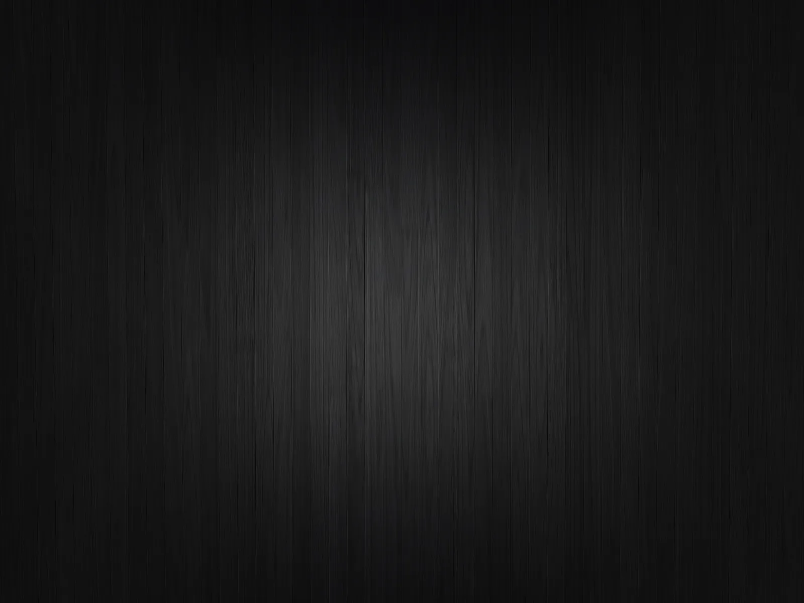 A soft light lands in the middle of a dark timber panel, the vertical grain running the full height of the frame.