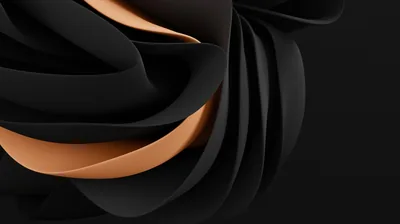 Folded dark ribbons curl in on themselves, revealing a warm copper surface on the inner faces.