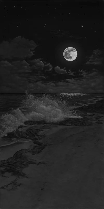 A full moon lights a line of surf rolling onto an empty shore, sand and cloud picked out in fine monochrome detail.