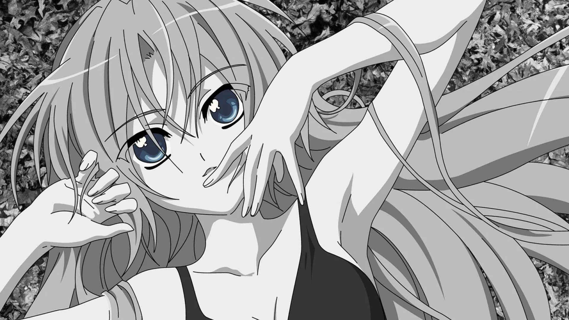Everything is greyscale except two bright blue eyes as she lies back in tall grass, one arm stretched above her head.