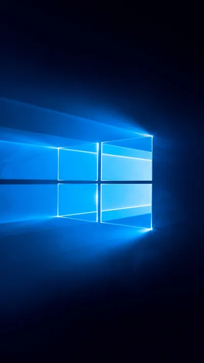 The window mark glows blue with sharp rays of light streaking out behind it across a deep blue field.