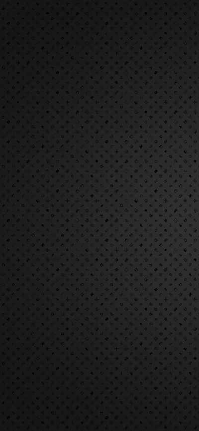 An even field of small punched holes covers a dark panel, lit slightly brighter down the centre and dropping off at both edges.