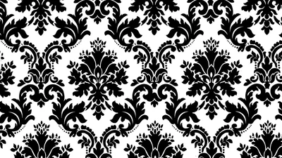 A repeating damask motif in dense black sits on clean white, the scrolls and leaves mirrored in even rows.