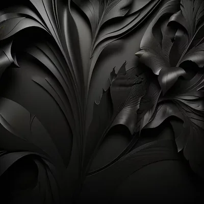 Large leaves carved in matte black stand out from a matching black wall, readable only by their shadows.