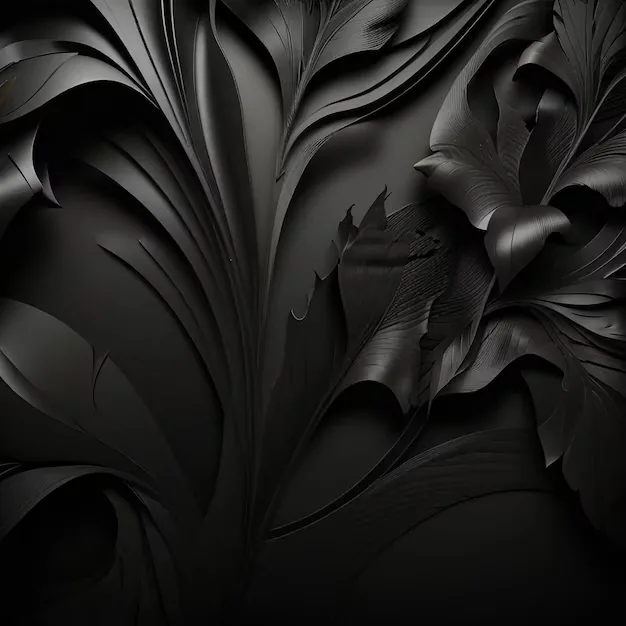 Large leaves carved in matte black stand out from a matching black wall, readable only by their shadows.