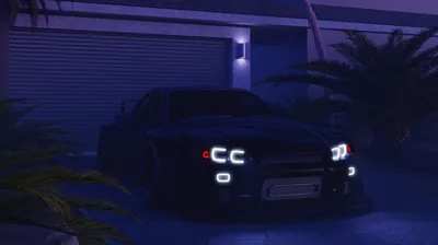 A dark JDM coupe waits outside a shuttered garage with palm fronds around it, quad headlights and a single wall lamp cutting the blue night.