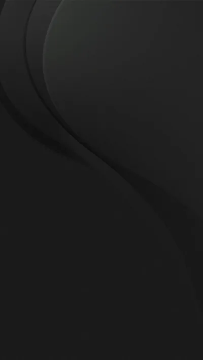 A pair of raised curves starts at the top left and flows toward the lower right across smooth graphite, the rest of the surface stays flat and clean.