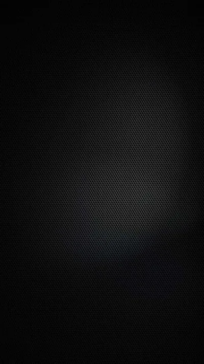 A fine mesh texture covers the frame with a faint cool glow lifting the middle, edges falling to black.