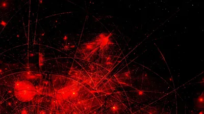 Scattered red glows sit behind a web of hairline light trails on black, the density thickening toward the bottom left.