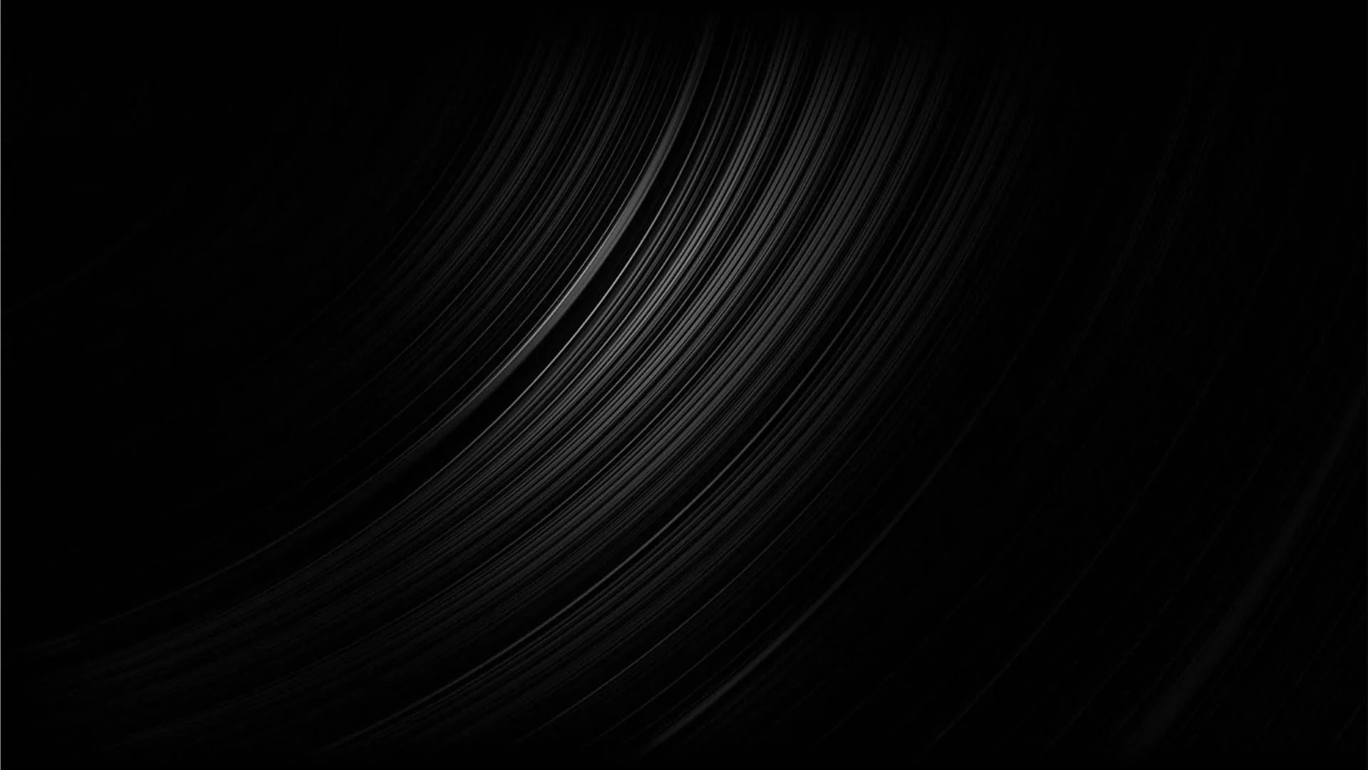 Long brushed streaks arc up from the lower left like grain on spun metal, thinning out until the right half is plain black.