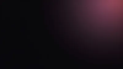 A warm maroon glow sits in the top right and falls away steadily to black across the rest of the frame.