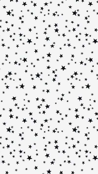 Tiny black stars in mixed sizes cover a soft grey-white background, spaced closely enough to read as texture from a distance.