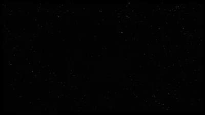 Small white points scatter unevenly across a flat black field, thinning toward the corners so the centre stays open for icons.