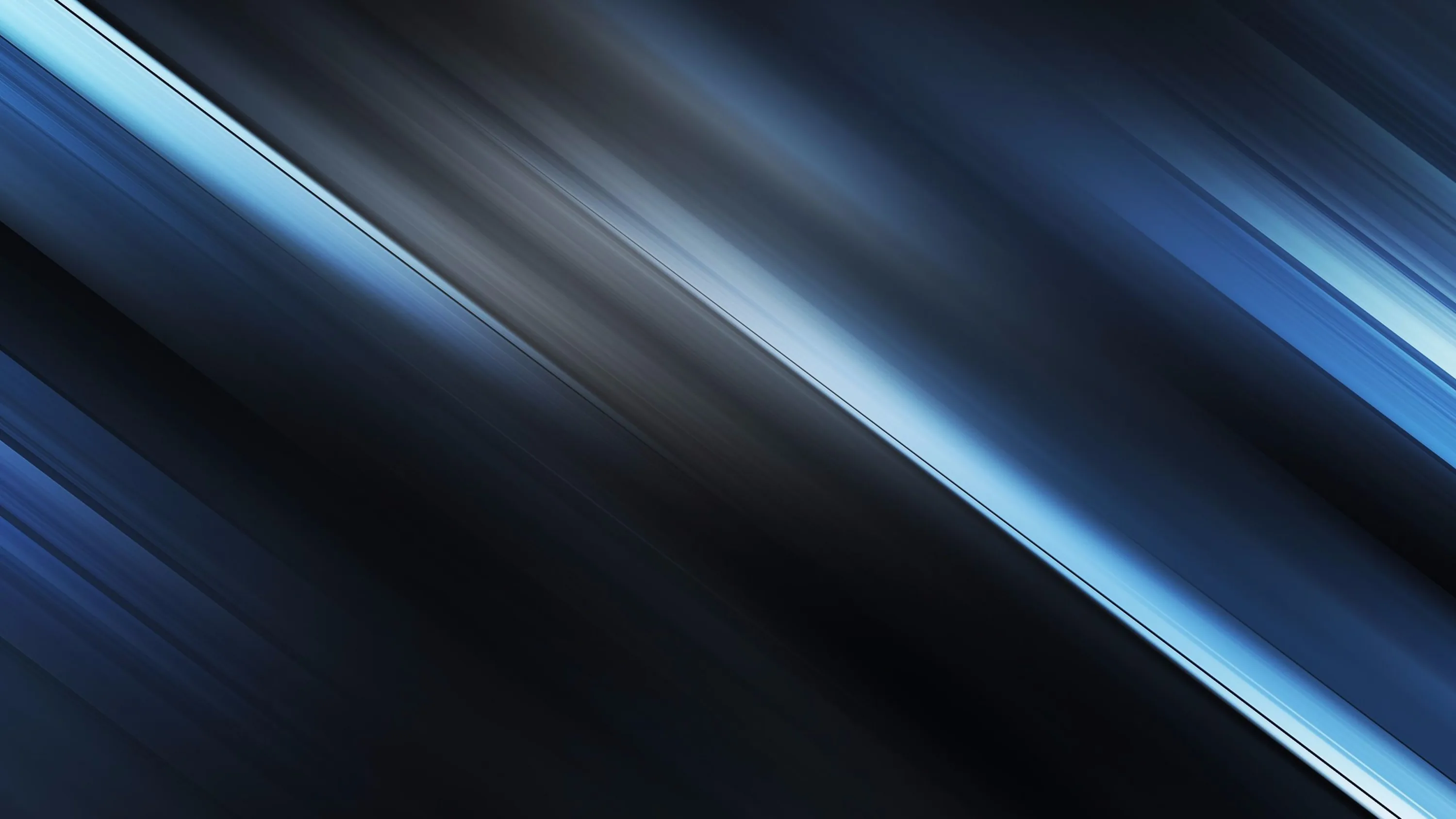 Long motion-blurred bands cut across the frame at a slant, steel blue on the upper half sliding into near-black at the base.