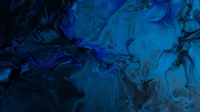 Poured ink in cobalt, teal and white swirls together in fine veins, the paint thinning to near-black along the lower edge.