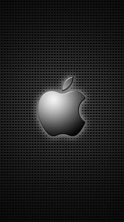A chrome Apple logo raised off a perforated metal sheet, the punched grid running behind it and darkening toward the corners.