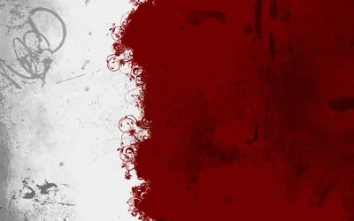 Dark red bleeds across the right two thirds of a pale concrete wall, the boundary breaking into fine curling tendrils.