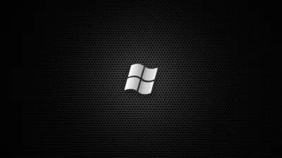 A small white window mark sits at the centre of a fine hexagonal mesh, the light fading toward the corners.